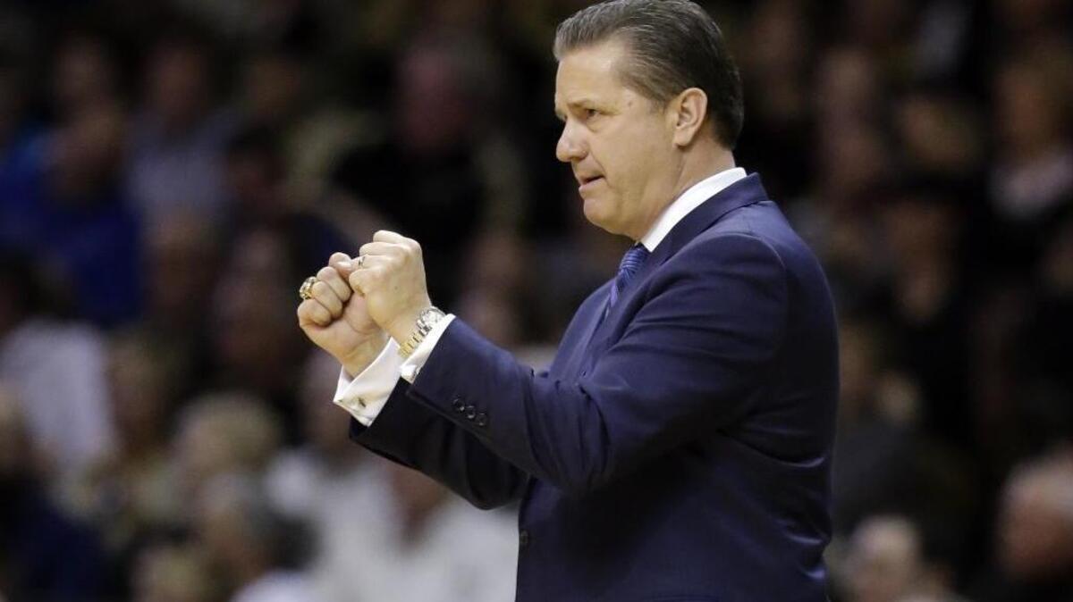 Kentucky head coach John Calipari gestures as he watches the action in the first half of an NCAA college basketball game against Vanderbilt Saturday, Feb. 27, 2016, in Nashville, Tenn.
