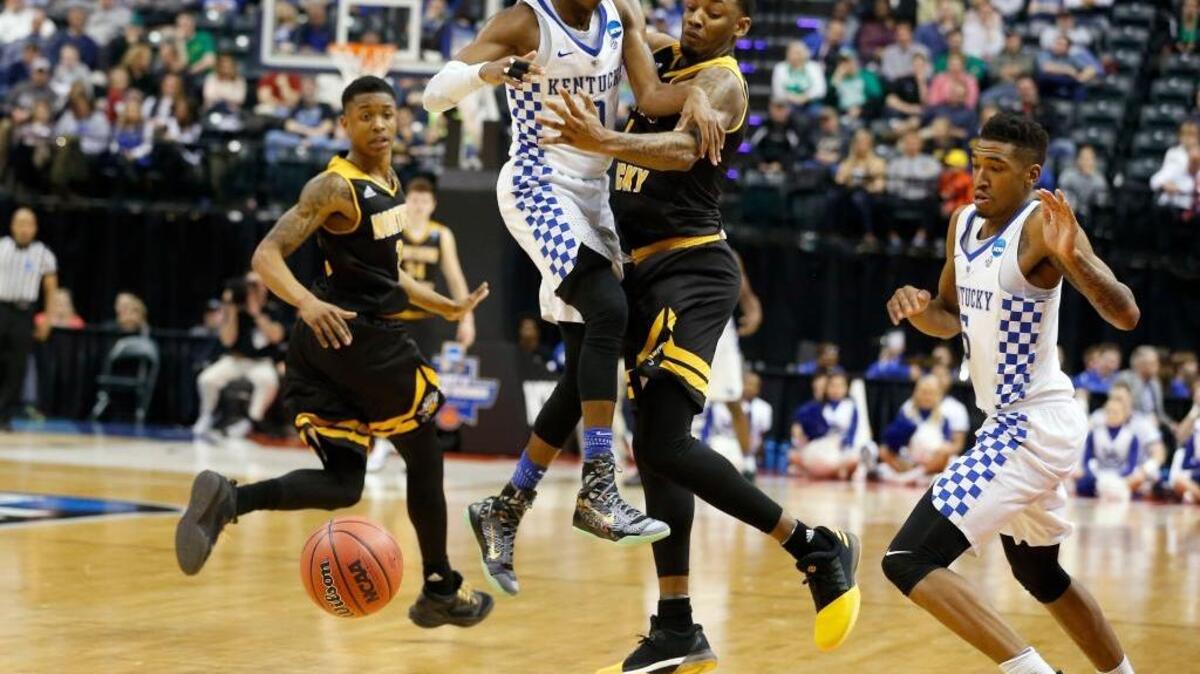 Kentucky guard De’Aaron Fox (0) and Northern Kentucky forward Jeff Garrett (4) collided as Fox loses the ball during UK’s 79-70 win over the Norse in a first round NCAA tournament game in Bankers Life Fieldhouse in Indianapolis, In., Friday, March17, 2017.