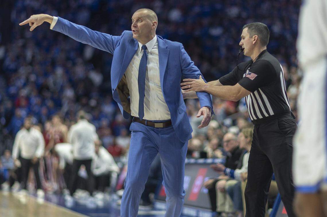 An official pulls Kentucky Wildcats head coach Mark Pope back from the court during a game against the Indiana Hoosiers at Rupp Arena on Saturday.