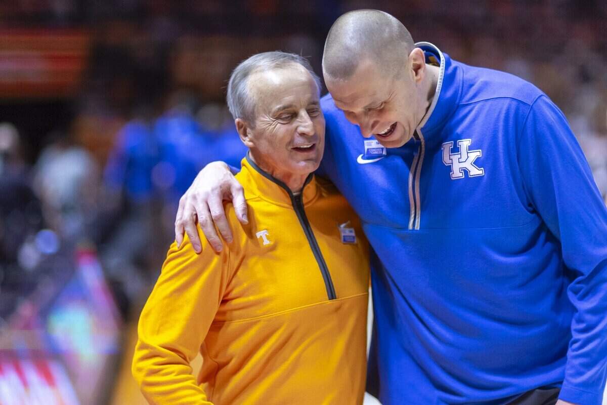 Tennessee head coach Rick Barnes and Kentucky head coach Mark Pope talk before a game at Thompson-Boling Arena in Knoxville, Tennessee on Jan. 28, 2025.