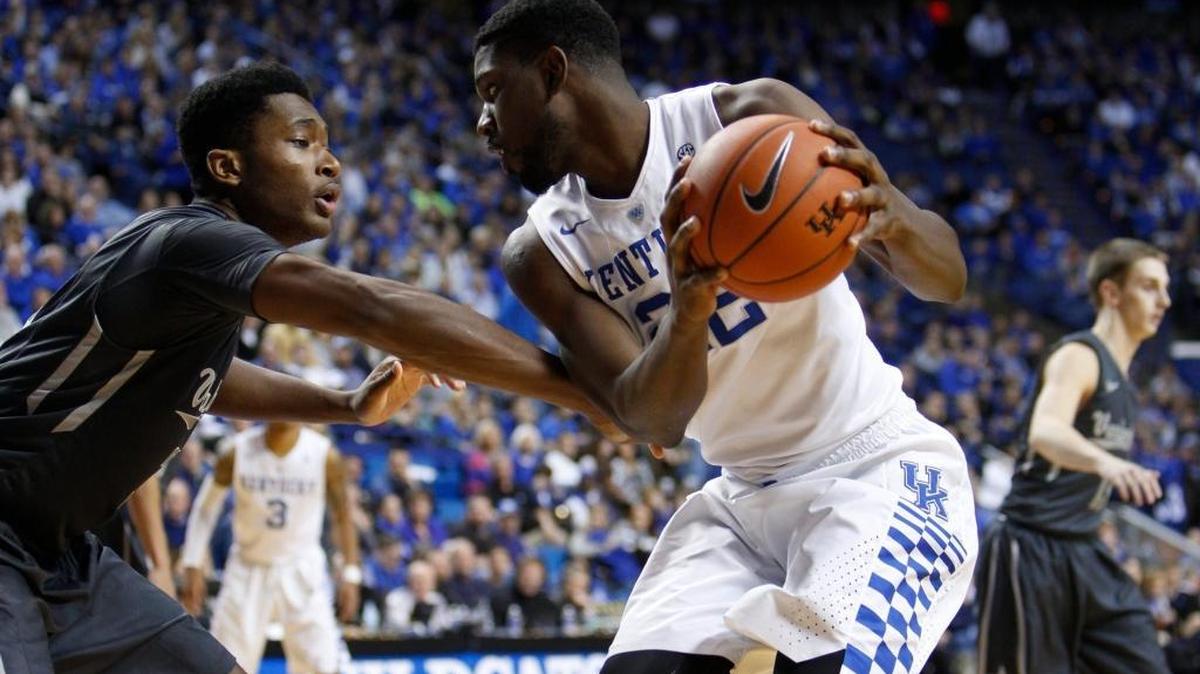 Kentucky forward Alex Poythress, right, drives past Vanderbilt center Damian Jones in the first half. The University of Kentucky hosted Vanderbilt University, Saturday, Jan. 23, 2016 at Rupp Arena in Lexington.