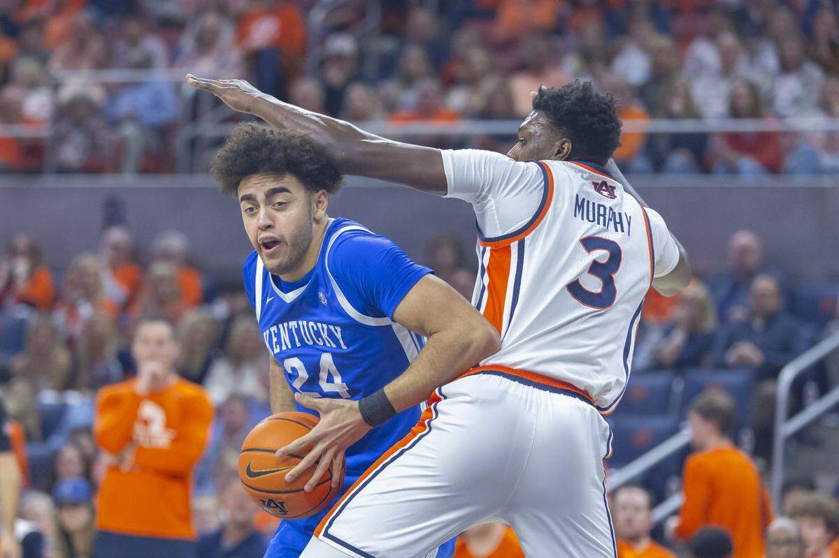 /k34/ moves the ball as Auburn Tigers forward Keshawn Murphy (3) defends during a game at Neville Arena in Auburn, Alabama, on Saturday, Feb. 21, 2026. 
