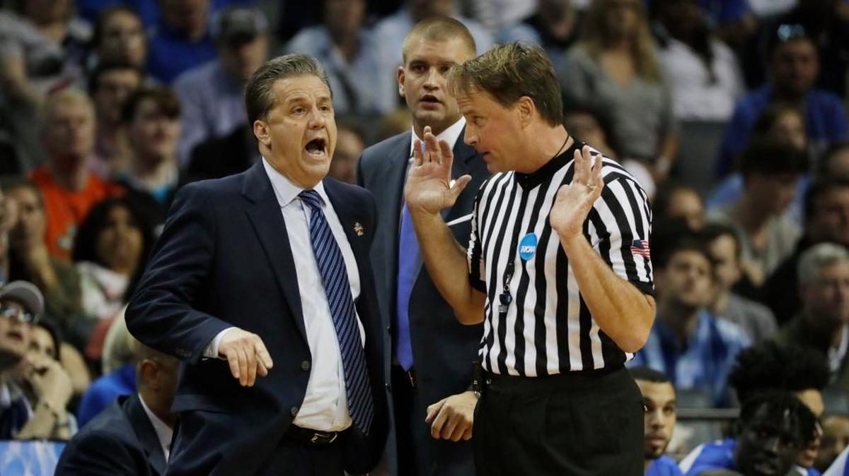 Kentucky head coach John Calipari argued a call with referee John Higgins during an NCAA Tournament game against North Carolina at Memphis, Tenn. Higgins was harassed online and at his place of business by angry fans after the game. The harassment included death threats and negative reviews of his business.