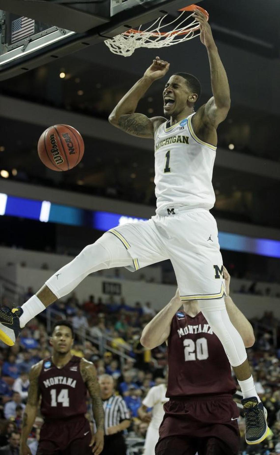 Michigan guard Charles Matthews throws down a dunk in the NCAA Tournament.