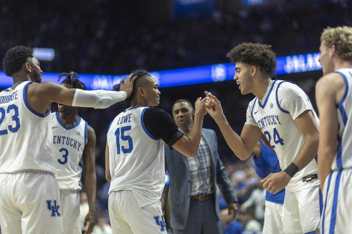 Kentucky guard Jaland Lowe is congratulated by his teammates after scoring a basket during the win over Indiana on Saturday.