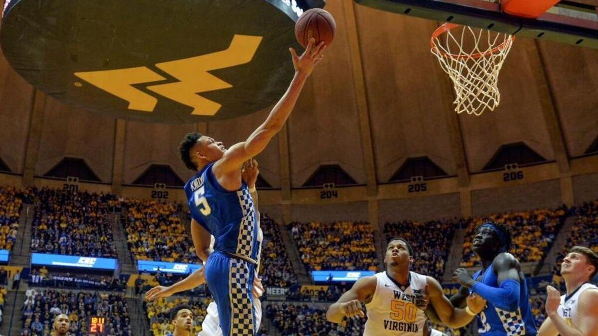 Kentucky forward Kevin Knox attempted a layup over West Virginia forward Sagaba Konate during the second half in Morgantown, W.Va., on Saturday night. The Cats won the game 83-76 behind 34 points from Knox and returned to the AP Top 25.