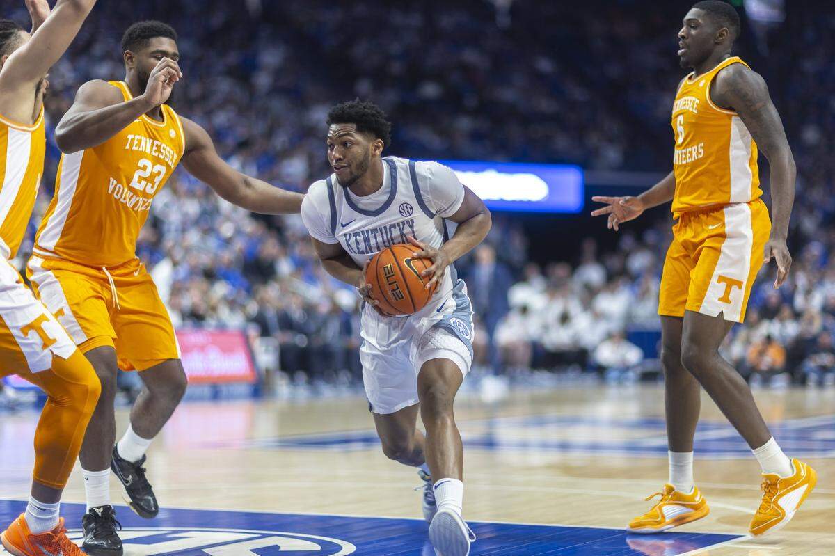 Kentucky Wildcats forward Mouhamed Dioubate (23) drives the ball as Tennessee Volunteers forward Jaylen Carey (23) defend during a game at Rupp Arena in Lexington, Ky., on Saturday, Feb. 7, 2026. 