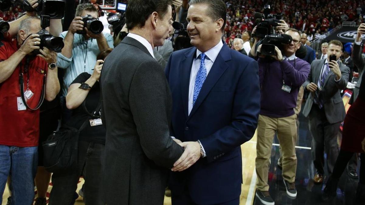Louisville Cardinals head coach Rick Pitino talked with Kentucky Wildcats head coach John Calipari when the teams met at the KFC Yum Center in Louisville in December.
