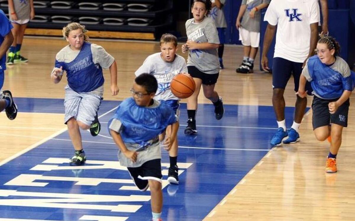 Aaron Wyckoff, 11, of Plainfield, Ill., dribbled down the court during a scrimmage that included E. J. Floreal and Andrew Harrison during UK Coach John Calipari's Pro Camp at the Joe Craft Center in 2015. Dates for Calipari’s Father/Son and Overnight Camps were announced Thursday.