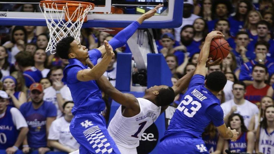 Kentucky guard Jamal Murray (23) blocked a shot by Kansas guard Wayne Selden Jr. as Skal Labissiere tried to help Saturday night.