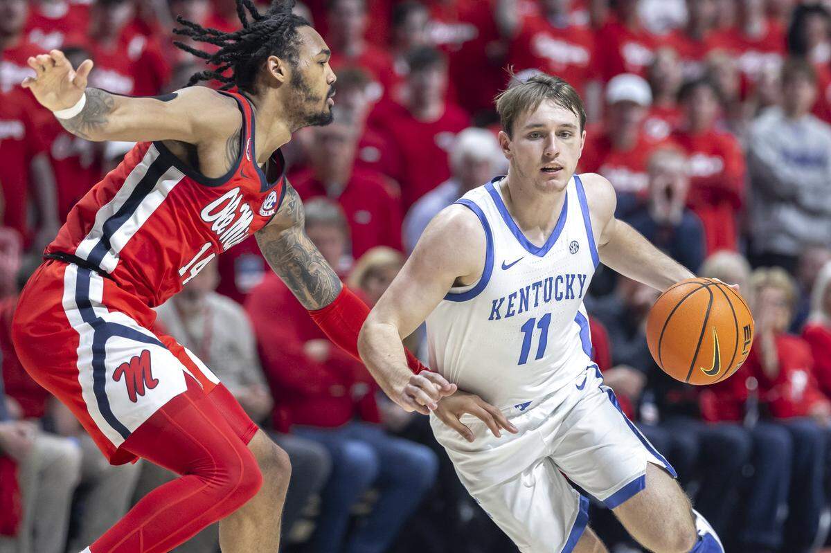 Travis Perry, right, was a freshman guard at Kentucky last season and transferred to Ole Miss for the 2025-26 campaign.