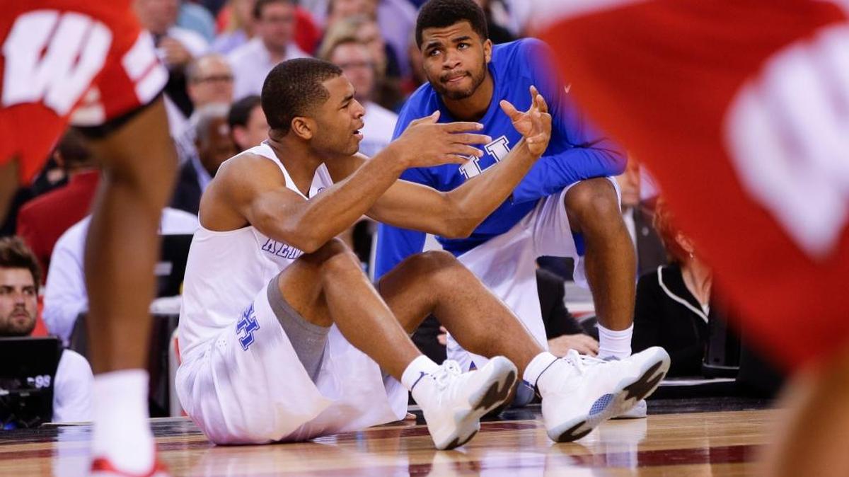 Kentucky Wildcats guard Aaron Harrison (2) and Andrew Harrison looked on waiting to check in as Wisconsin defeated Kentucky 71-64 in the NCAA Final Four on Saturday April 4, 2015, in Indianapolis.