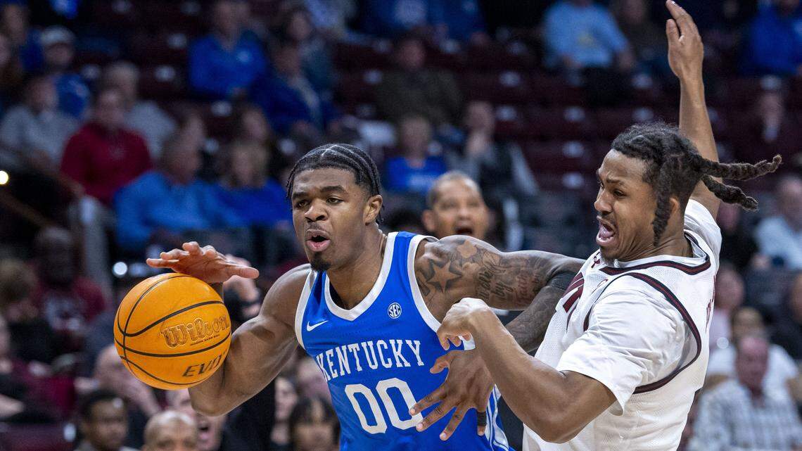 Kentucky Wildcats guard Otega Oweh (00) drives on South Carolina Gamecocks guard Meechie Johnson (5) during UK’s 72-63 win over South Carolina on Tuesday, Feb. 24, 2026, at Colonial Life Arena in Columbia, South Carolina. 