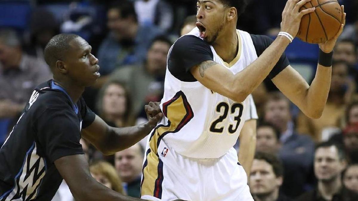 New Orleans Pelicans forward Anthony Davis drives against Minnesota Timberwolves center Gorgui Dieng during a January game in the Smoothie King Center.