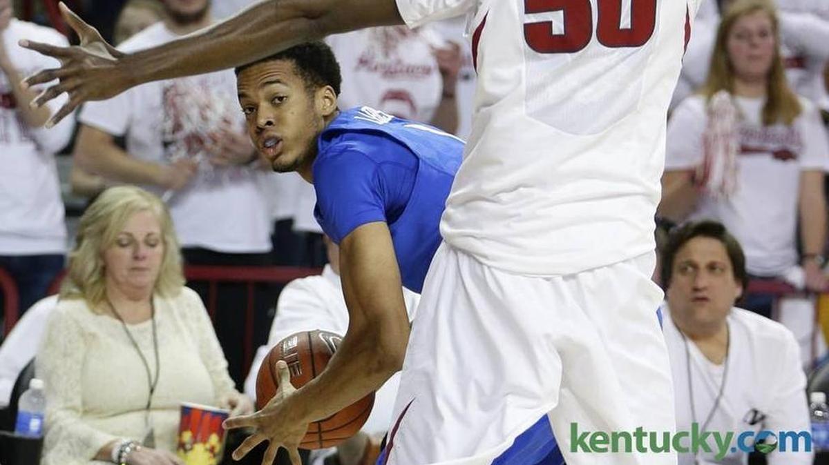 UK freshman Skal Labissiere looked to pass around an Arkansas defender Thursday night. Labissiere had 11 points, three rebounds and three blocked shots in the Wildcats’ victory.
