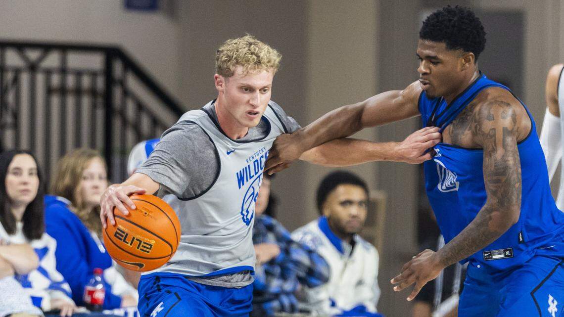 Kentucky guard Collin Chandler, left, tries to get past the defensive pressure of Wildcats teammate Otega Oweh during the Blue-White Game last Friday at Memorial Coliseum. Both players have been praised this preseason for their defense. 