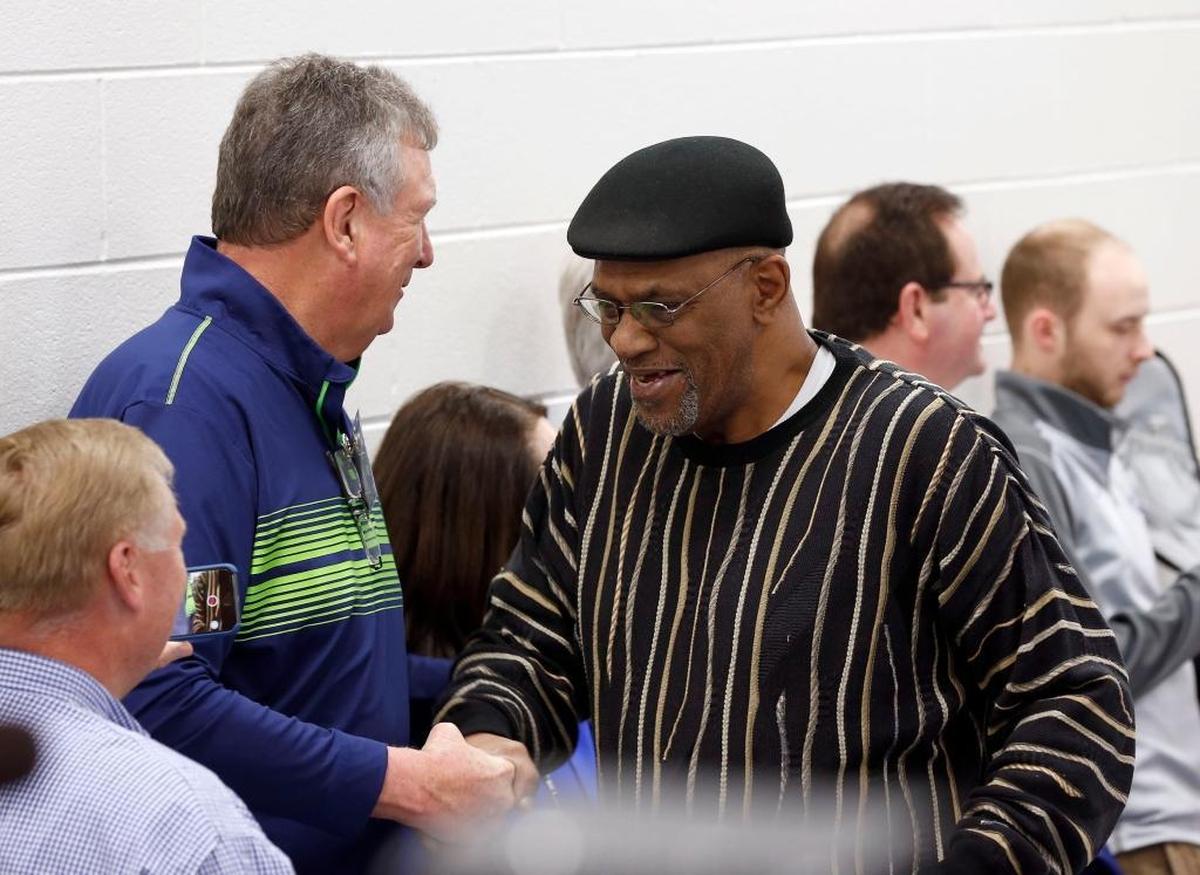 Former player Rick Robey, left, shook hands with former teammate James Lee, during a media availability for the University of Kentucky’s 1978 national championship men’s basketball team in Rupp Arena on Thursday. Members of the team are getting back together for a reunion in Lexington this weekend, 40 years after winning the title.