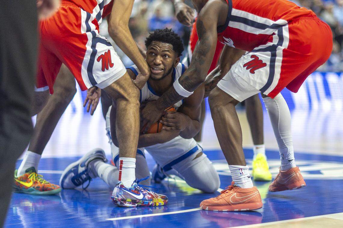 Kentucky Wildcats forward Mouhamed Dioubate (23) tries to call a timeout after getting a rebound during a game against the Mississippi Rebels at Rupp Arena on Saturday. 