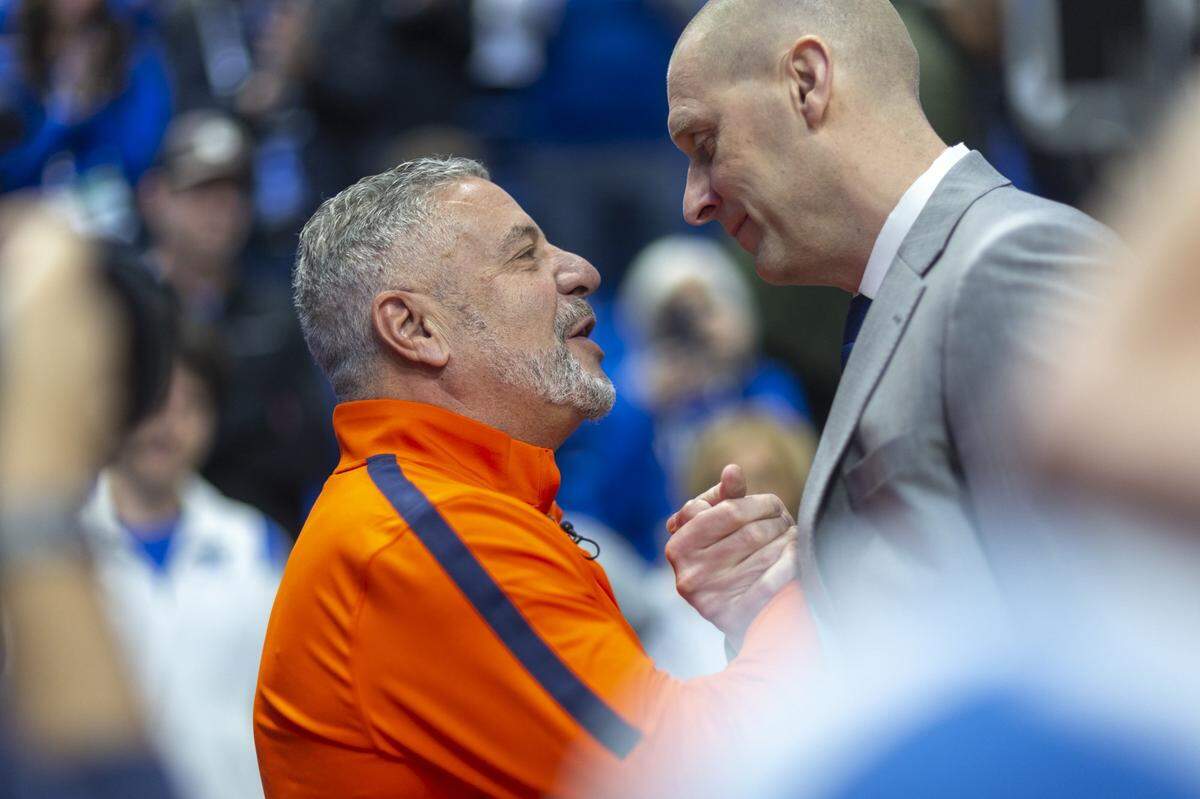 Auburn’s Bruce Pearl, left, and Kentucky head coach Mark Pope greet one another before a game at Rupp Arena on March 1, 2025.