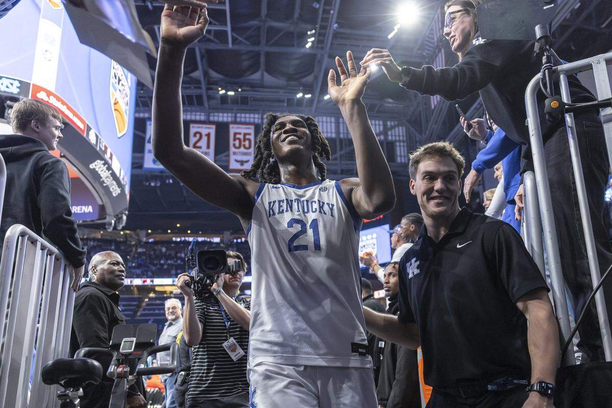 Kentucky forward Jayden Quaintance high-fives fans following a game against the St. John's Red Storm on Saturday.