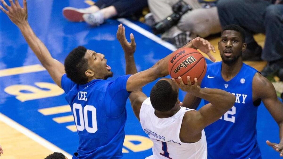 Kentucky Wildcats forward Marcus Lee (00) defended Kansas Jayhawks guard Wayne Selden Jr. (1) during the second half as Kansas hosted the University of Kentucky at Allen Fieldhouse on Saturday Jan. 30, 2016 in Lawrence, Kan.