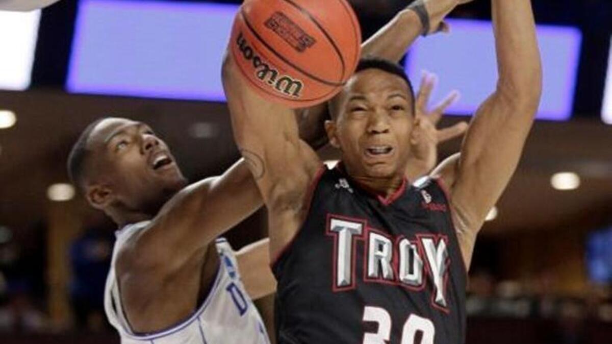 Troy’s Alex Hicks (30) dunks against Duke's Harry Giles (1) during the first half in a first-round game of the NCAA Tournament in Greenville, S.C., Friday, March 17, 2017. Duke won 87-65.