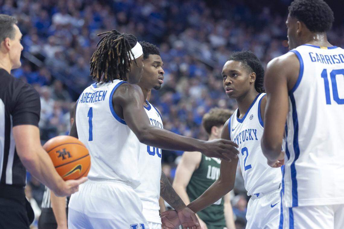 Kentucky Wildcats guards, from left, Denzel Aberdeen, Otega Oweh and Jasper Johnson huddle up with Brandon Garrison during an 88-46 win over Loyola (Maryland) on Friday night.