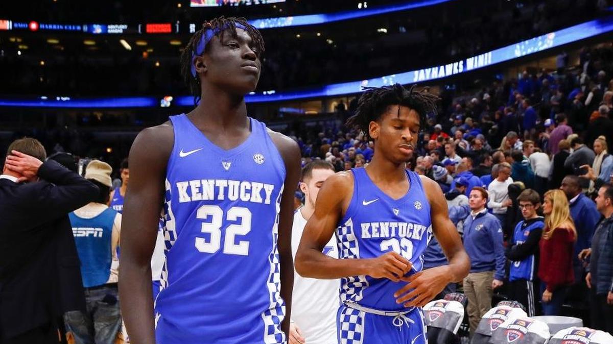 Kentucky forward Wenyen Gabriel (32) and guard Shai Gilgeous-Alexander (22) left the court following their 65-61 loss to Kansas during the State Farm Champions Classic at the United Center in Chicago, Ill., Nov. 14, 2017.