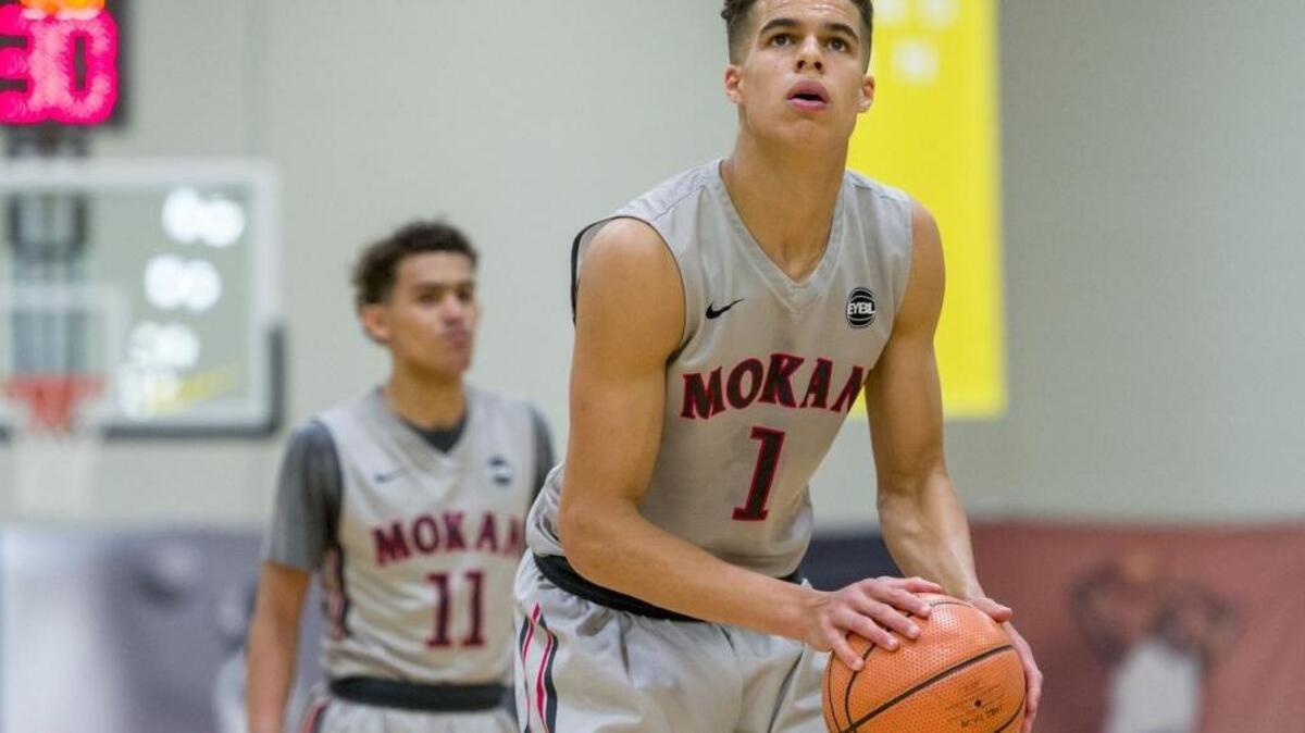 Class of 2017 basketball recruits Michael Porter Jr. (1) and Trae Young (11) have often discussed playing for the same college team.