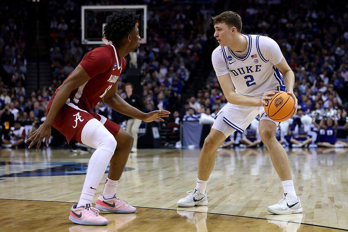 National player of the year Cooper Flagg looks to pass as Mouhamed Dioubate defends him on the perimeter in Duke’s victory over Alabama in the Elite Eight round of the 2025 NCAA Tournament.