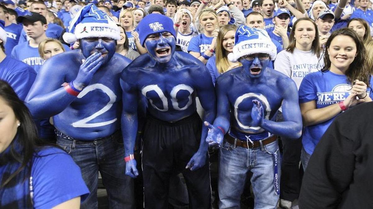 Kentucky fans, including painted students Andrew Strother, left, John Steele and Thomas Green cheered before a game against Drexel in Rupp Arena in Lexington on Dec. 21, 2009.