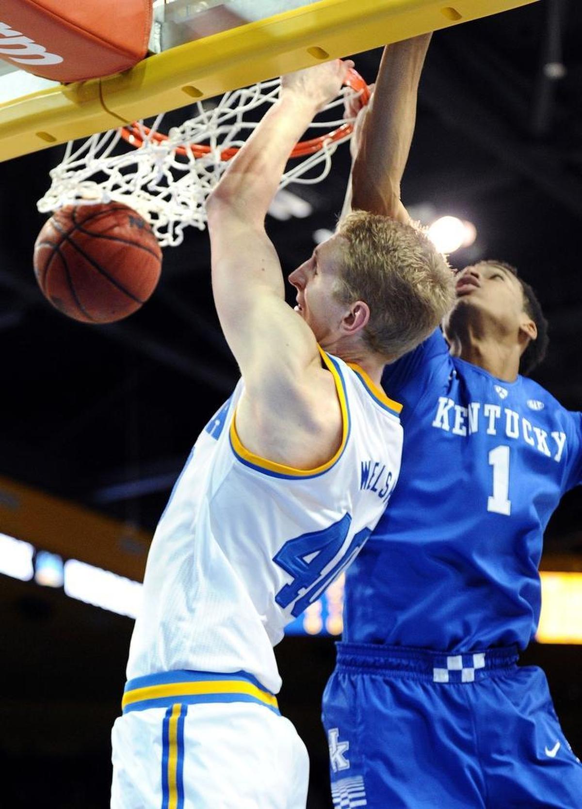 UCLA’s Thomas Welsh dunked over Kentucky’s Skal Labissiere during UCLA’s 87-77 win over UK in Los Angeles in 2015.