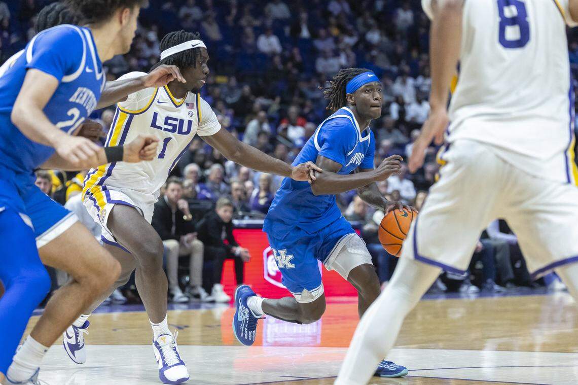 Kentucky Wildcats guard Denzel Aberdeen (1) drives the ball in front of LSU Tigers center Michael Nwoko (1) during a game at the Pete Maravich Assembly Center in Baton Rouge, La., on Wednesday, Jan. 14, 2026.  