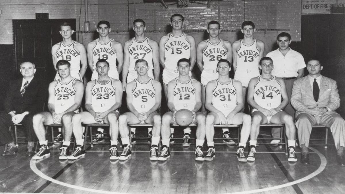 Kentucky’s 1949 NCAA champions. Front row: Coach Adolph Rupp, Jim Line, Cliff Barker, John Stough (5), Ralph Beard, Joe Hall, Garland Townes, Assistant Coach Harry Lancaster. Back row: Dale Barnstable, Walt Hirsch, Wallace Jones, Alex Groza, Bob Henne, Roger Day, Manager Humsey Yessin.