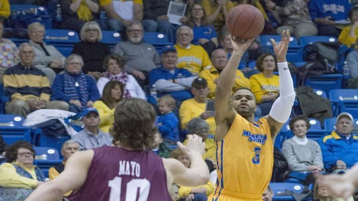 Morehead State’s Corban Collins shot a three-pointer against Eastern Kentucky’s Nick Mayo during their Ohio Valley Conference game Feb. 11 in Morehead.