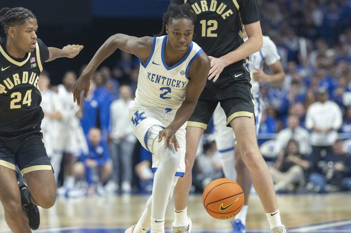 Kentucky Wildcats guard Jasper Johnson (2) drives the ball as Purdue Boilermakers guard Gicarri Harris (24) follows during an exhibition game at Rupp Arena in Lexington, Ky., on Friday, Oct. 24, 2025.  