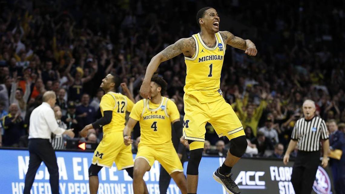 Charles Matthews (1) and his teammates celebrated Michigan’s win over Florida State on Saturday, which put the Wolverines into the Final Four.