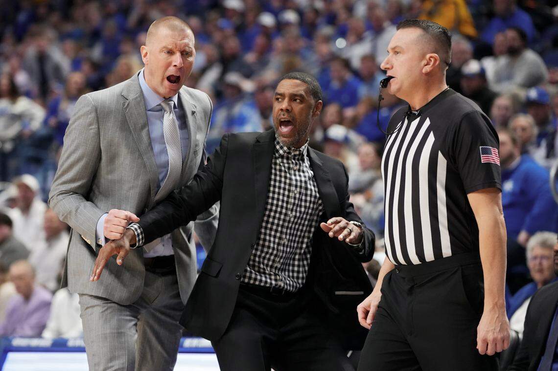 Kentucky coach Mark Pope (left) reacts toward official Bob Rorke (right) in the first half against Missouri on Jan. 7 at Rupp Arena as UK assistant Jason Hart (middle) intervenes. Rorke would call Pope for his first technical foul as the Wildcats’ coach in the game. 