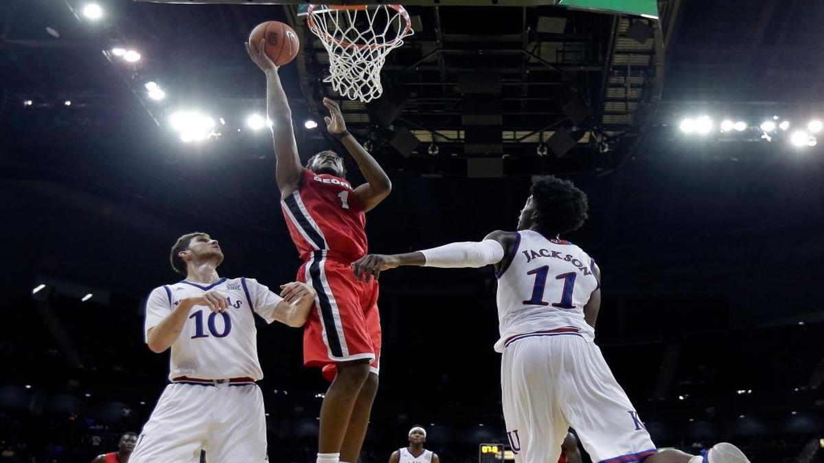 Georgia's Yante Maten got past Kansas' Sviatoslav Mykhailiuk (10) and Josh Jackson. Maten is the league’s No. 2 scorer.