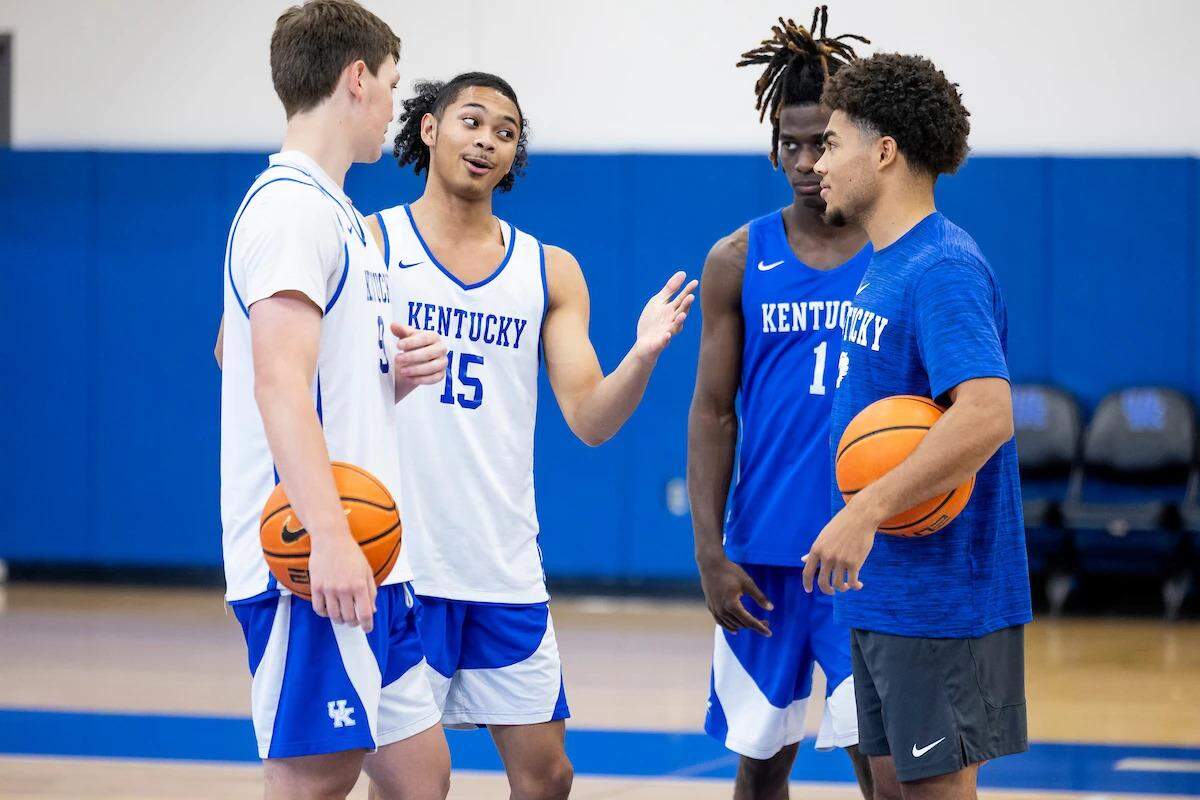 Jaland Lowe (15) talks with Kentucky basketball teammates during one of the team’s practices this preseason.