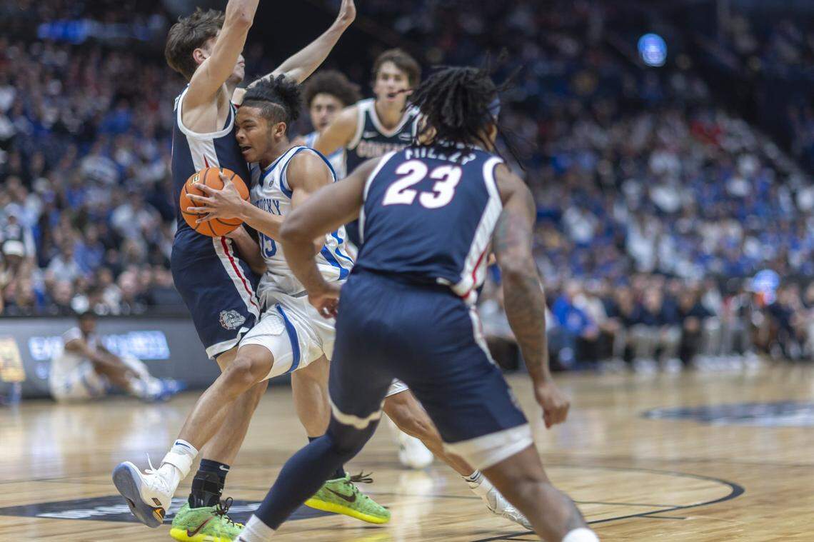 Kentucky guard Jaland Lowe (15) tries to drive the ball as Gonzaga guard Mario Saint-Supery (17) defends during a game at Bridgestone Arena in Nashville, Tenn., on Friday,  