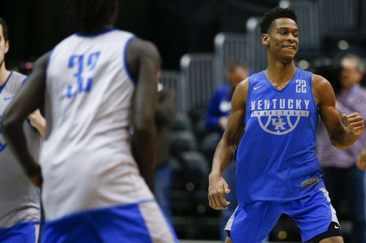 Shai Gilgeous-Alexander (22) and Wenyen Gabriel (32) warmed up during Kentucky’s practice at Philips Arena in Atlanta on Wednesday.