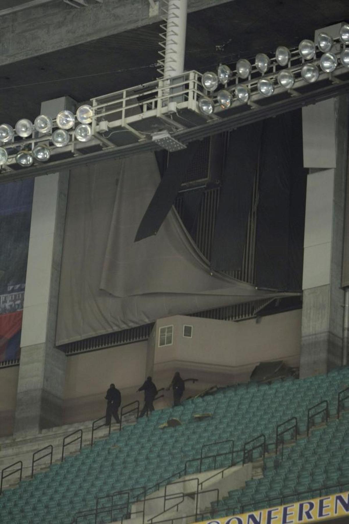 Georgia Dome employees inspected the interior of the facility after severe weather shook the building and postponed play in the SEC Tournament in 2008.