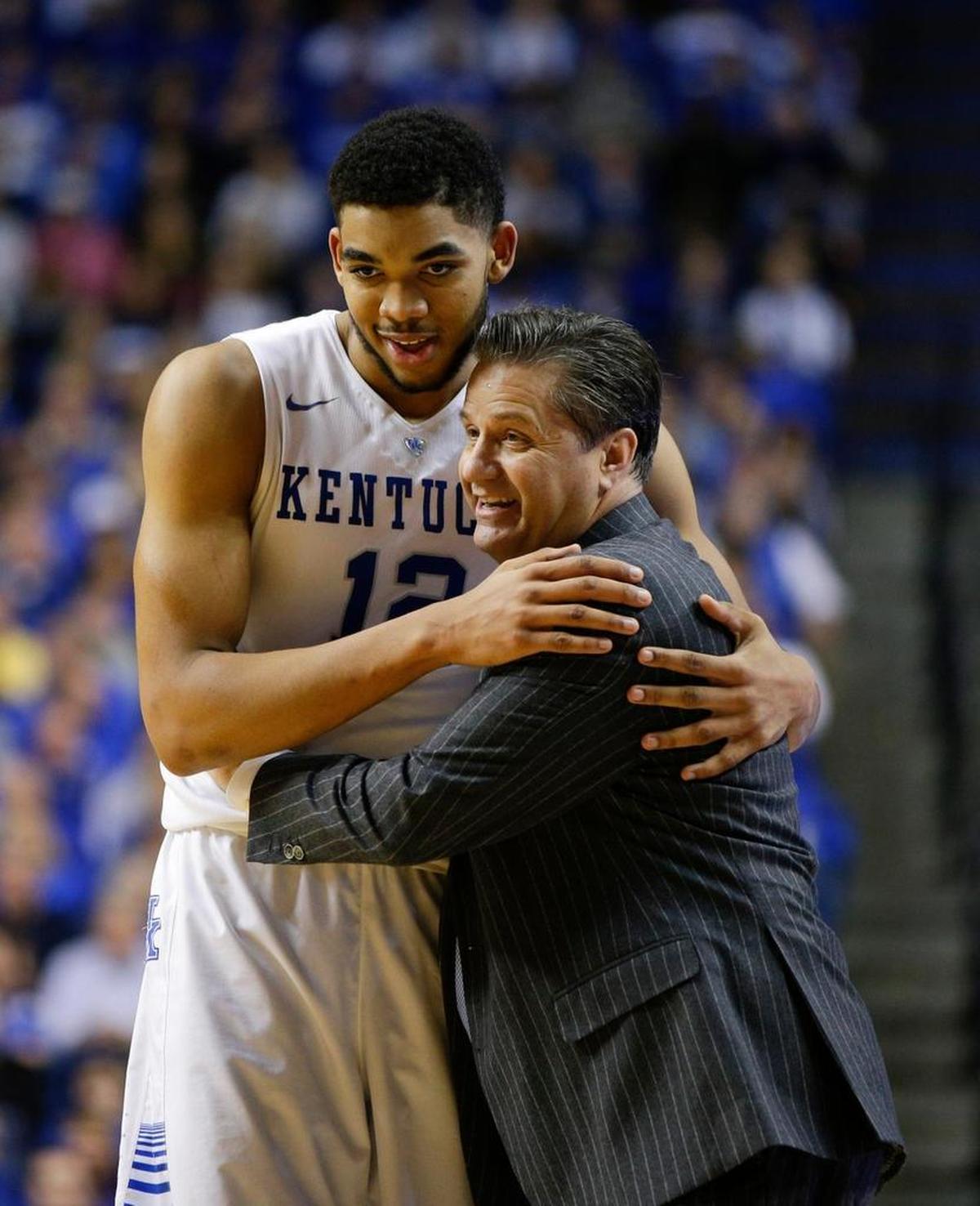 Former Kentucky basketball player Karl-Anthony Towns, left, averaged 10.3 points, 6.7 rebounds and 2.3 blocks while playing for head coach John Calipari, right, at UK during the 2014-15 season.