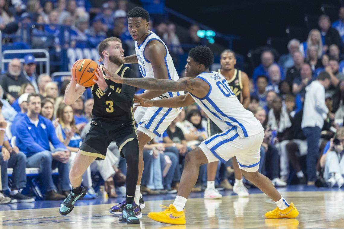 Kentucky guard Otega Oweh, right, and teammate Brandon Garrison pressure Purdue guard Braden Smith during an exhibition game at Rupp Arena on Oct. 24.