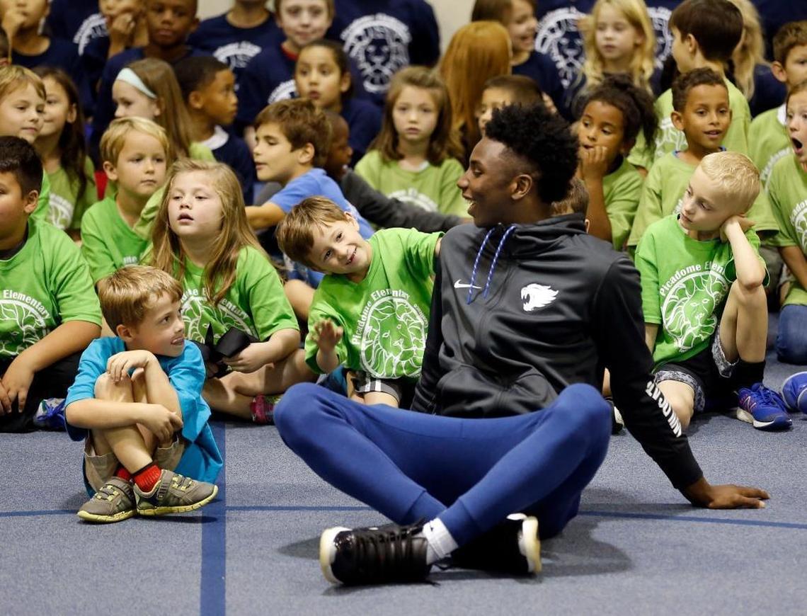 Kindergarten student Harris Barnes sat next to Hamidou Diallo as several members of the University of Kentucky men's basketball team made a visit to Picadome Elementary School, 1642 Harrodsburg Rd., in Lexington, Ky., Friday, September 15, 2017. Players delivered packed lunches to the school as part of the UK Athletics' God's Pantry program and then participated in various physical education activities and games with the students.
