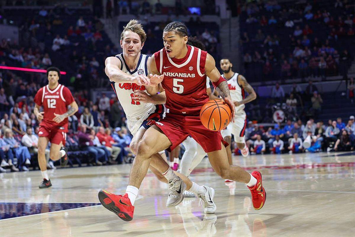 Arkansas guard Darius Acuff Jr. (5) drives against Ole Miss guard Travis Perry during the Razorbacks’ victory over the Rebels earlier this month.