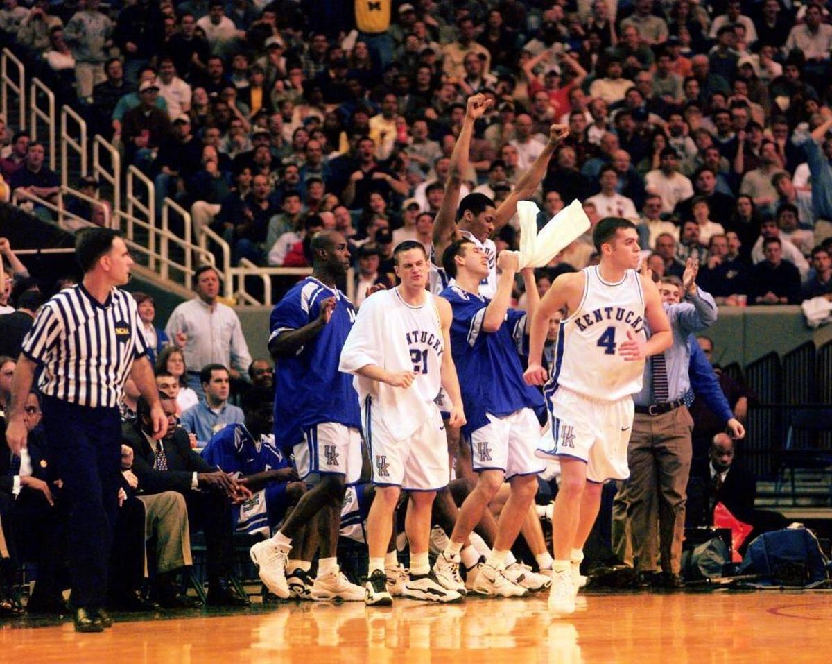 Kentucky’s Heshimu Evans, Cameron Mills, Scott Padgett, and Jamaal Magloire celebrated behind Steve Masiello (4) during the closing seconds of UK’s 88-61 win over Saint Louis in the second round of the NCAA South Regional at the Georgia Dome in Atlanta in 1998.