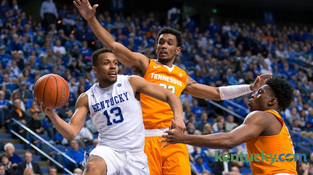 Kentucky guard Isaiah Briscoe, left, looks for an open teammate in the second half.