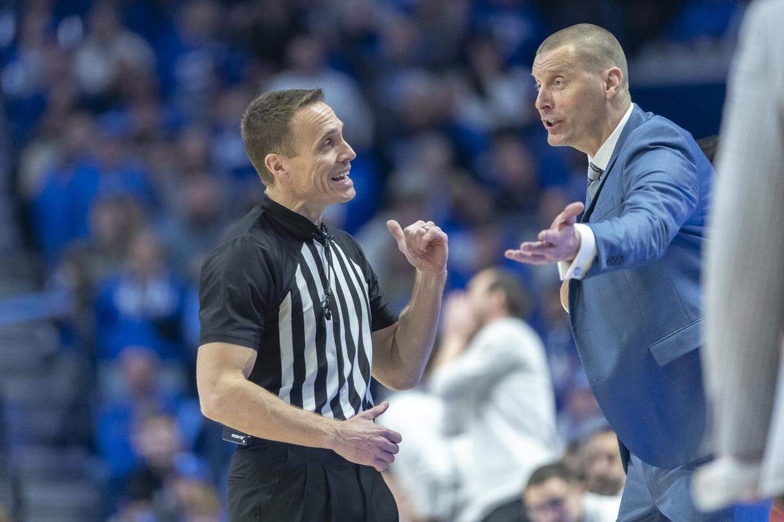 Kentucky Wildcats head coach Mark Pope talks with an official during a game against the Texas Longhorns at Rupp Arena in Lexington, Ky., on Wednesday, Jan. 21, 2026.  